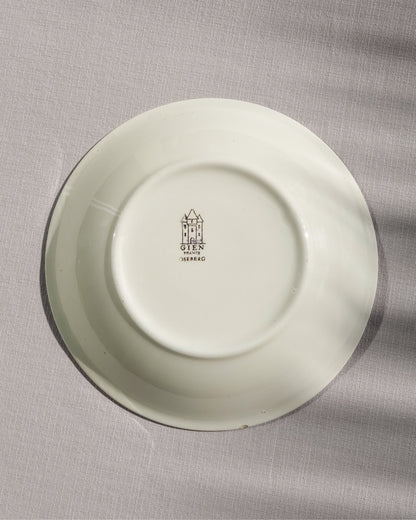 Assiette creuse au motif floral et géométrique de la marque Gien